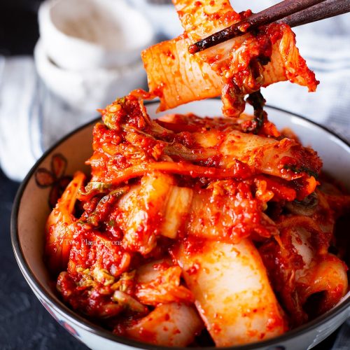 geotjeori-picking-up-some-fresh-kimchi-with-chopsticks
